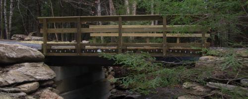 wooden bridge over creek
