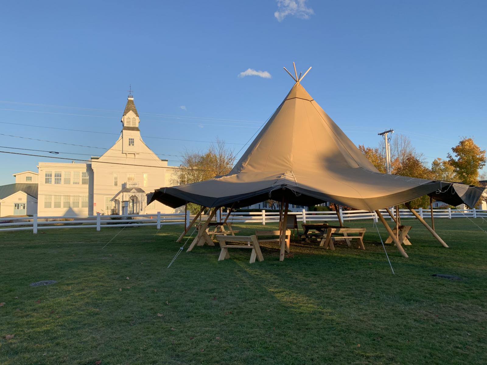 Outdoor classroom on the lawn at Craftsbury Academy, with school building in the background.