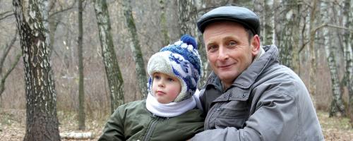 man and kid in woods